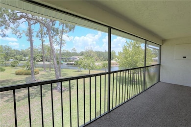 Unfurnished sunroom featuring a water view
