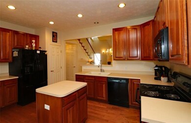 Kitchen with Custom maple cabinets and center isla