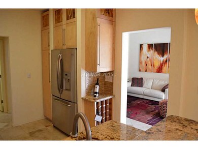 Property Photo. Kitchen showing wine rack & doorwa