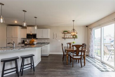 Breakfast bar, kitchen, dining area and slider to 