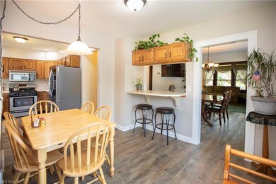 Large eating area in kitchen. New flooring