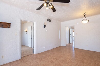 Living room w/ view of BR & kitchen