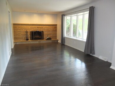 Formal living room has a large bay window, crown m