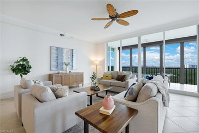 Tiled living room with ceiling fan, a healthy amou