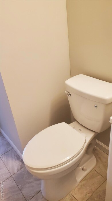 Bathroom with tile patterned floors
