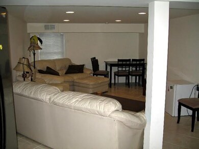 The huge den is just off the kitchen and could acc