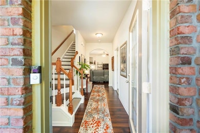 Entry foyer. Hardwood floors.