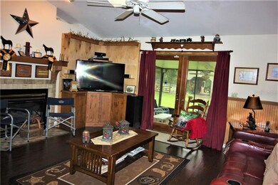 Living room with gas fireplace! Leads out to scree