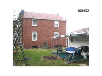 Rear of subject.  Covered patio off garage.