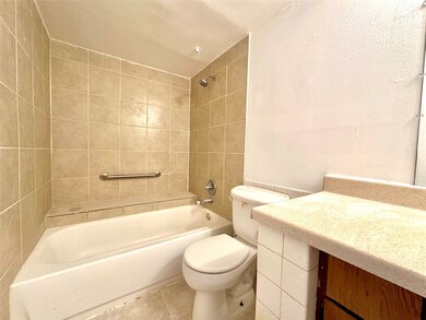 full bath with large vanity and storage