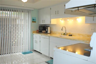 Kitchen with new countertops, backsplash and sink