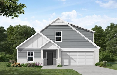 View of front of home with a garage and a front la