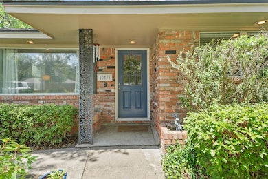 Covered porch protects your packages and guests fr