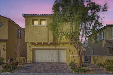 Mediterranean / spanish-style home featuring a gar