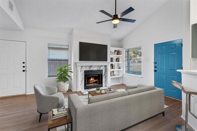 Living room featuring a fireplace, wood finished 