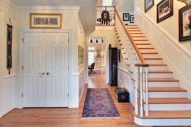 Foyer showing coat closet and stairway. There is a