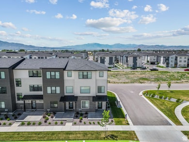 Aerial view of residential area featuring a mountainous background