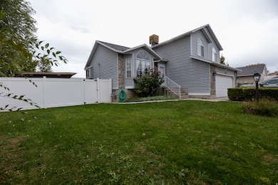 View of side of home with a gate