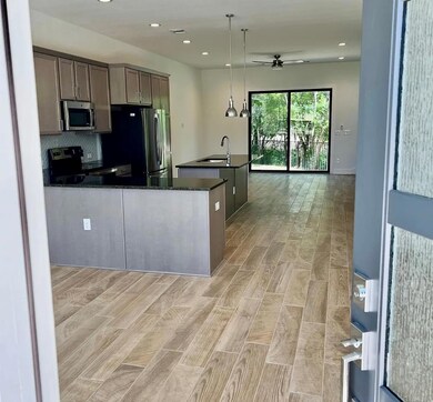 Kitchen with stainless steel appliances, a ceilin