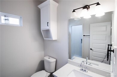 Bathroom featuring toilet and vanity