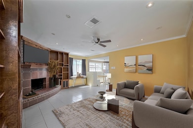 Family Room with fireplace.  This photo has been v