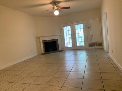 Unfurnished living room featuring a ceiling fan, 