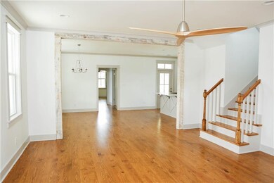 Real wood floors, and wood casings in view from li