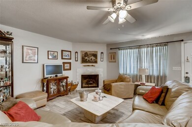 Family room with wood burning fireplace.