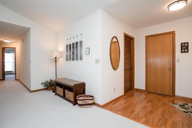 Enter condo onto laminate floor.  Laundry room is 