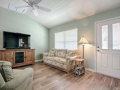 INSIDE, THIS HOME FEATURES VAULTED CEILINGS AND WI