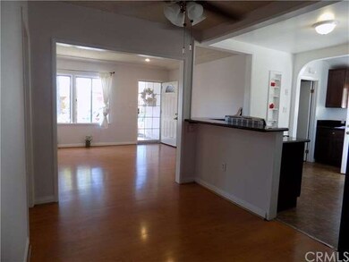 View from dining room to living room, kitchen and 