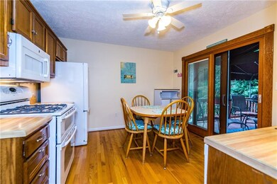 Eat in kitchen has plenty of cabinets for storing 