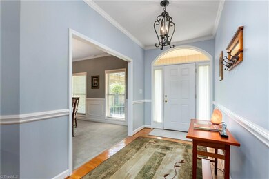 As you enter you are welcomed into the home with soft neutral colors, hardwood flooring & updated lighting.  The foyer opens to the Great Room and Formal Dining Room.