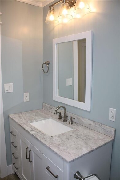 This spa like bathroom has a wonderful vanity with