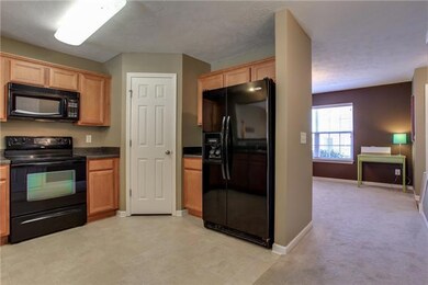 Beautiful Kitchen will please any cook. Abundant Counter Space and Cabinetry, Black Appliances