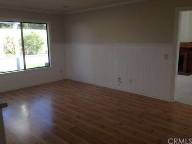 Family room adjoins the kitchen.  Wainscoting thro