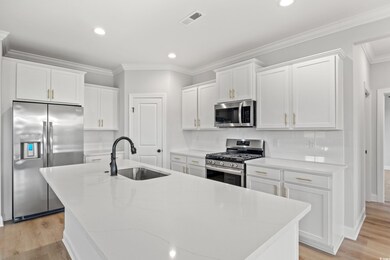 Kitchen with decorative backsplash, stainless stee