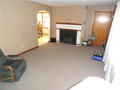 Living Room. Recently installed carpet and woodbur