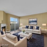 Living area featuring wood finished floors and a g