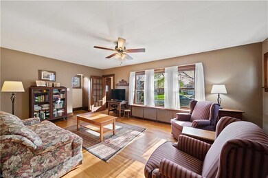 Living room 21 x 12 with brick gas fireplace. hard