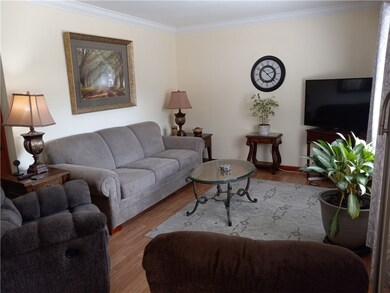 Newer laminate flooring and crown molding.