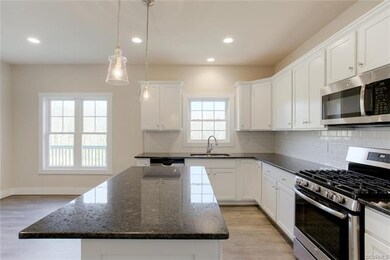 Kitchen Includes Pendant Lighting Over the Island 