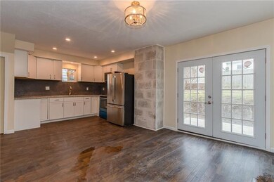 New lighting throughout, new french doors leading 