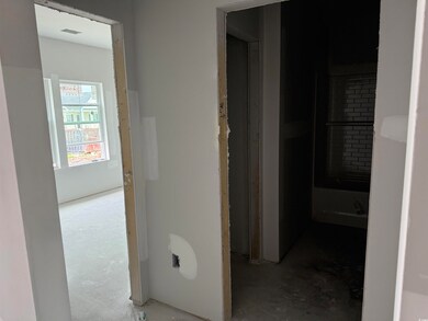 Hall featuring concrete flooring