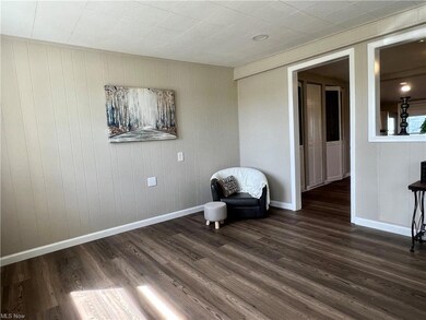 Living area with dark hardwood floors