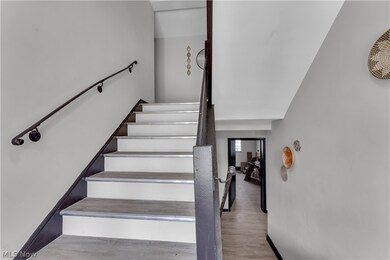 Stairway with light wood-type flooring