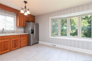 Kitchen with new tile and never-used new stainless