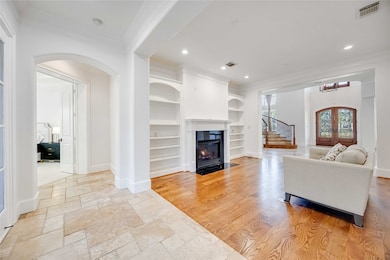 This elegant living area features hardwood floors,
