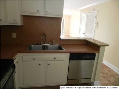 View of kitchen looking toward dining room. Kitche