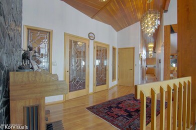 Foyer With Natural Oak Hardwood Floors